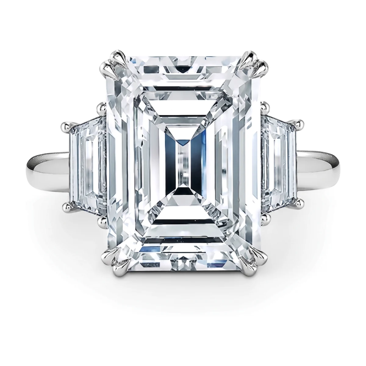 An emerald-cut white diamond three-stone ring in platinum