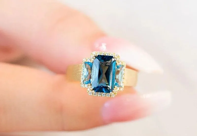 A blue topaz ring worn home