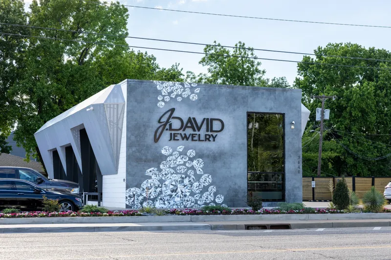 The Brookside showroom: a gray building with painted diamonds tumbling around the J. David Jewelry letters